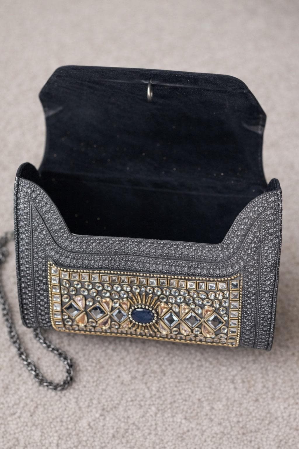 oxidised and studded metal sling bag
